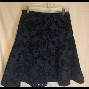 Blue skirt with black velvet patterns